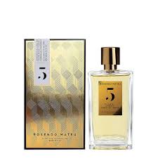 a bottle of perfume next to a box