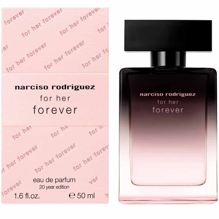 a bottle of perfume sitting next to a box